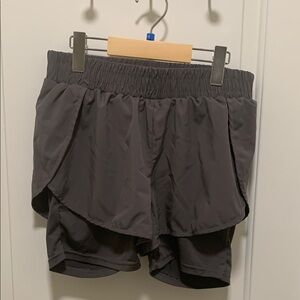 Runway Ready Black Athletic Shorts with Layered Design and Wide Waistband